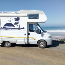 Vinile decorativo camper tramonto sulla spiaggia